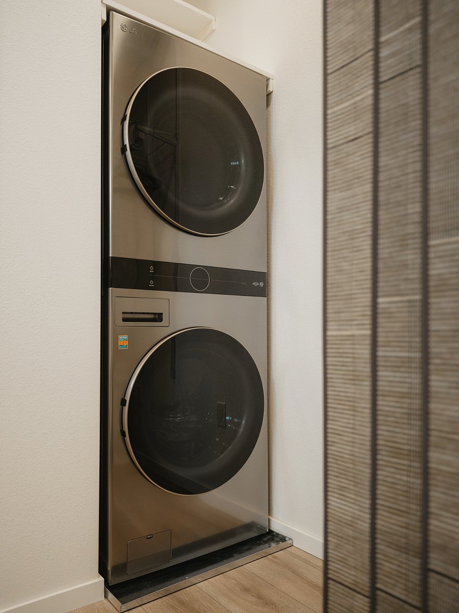 LG WashTower tucked away in the closet space for easy access to do full loads of laundry.