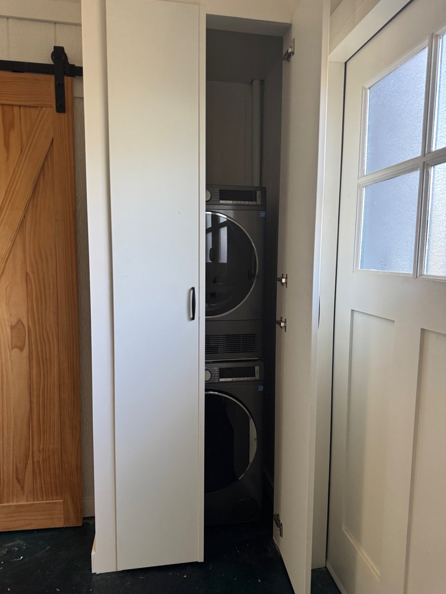 Broom, vacuum & mop in laundry closet