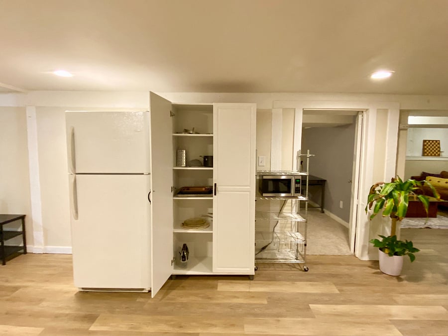 Full sized fridge, microwave, and essential pots and pans