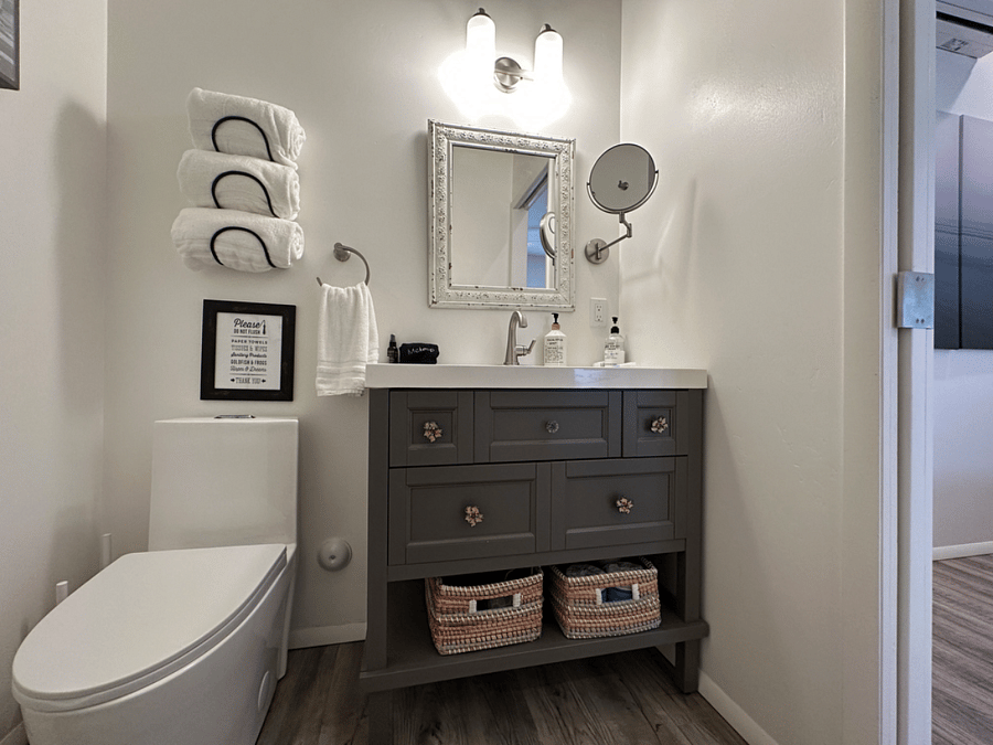 The bathroom has excellent lighting, dimmer switch lighting, bathroom fan & heat.