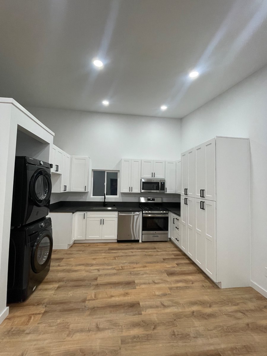 Immaculate kitchen + Laundry space