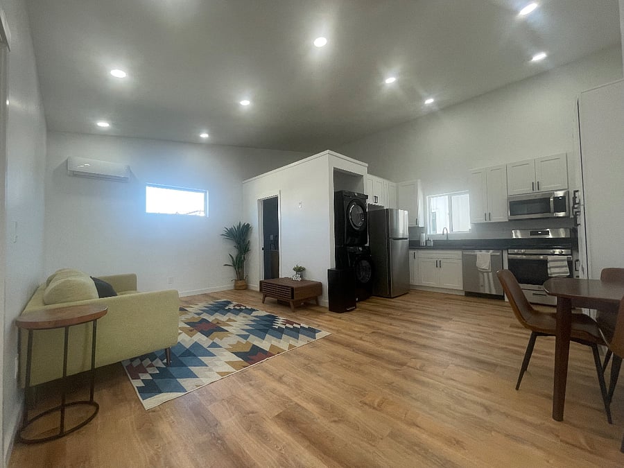 Open space with natural light. Living room, dining area and kitchen