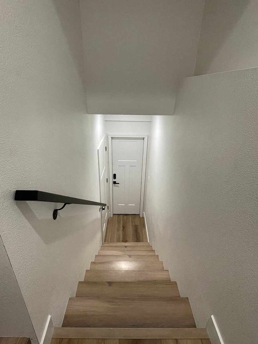 Staircase down to your private unit. You will have access to the camera facing your front door for added peace of mind.