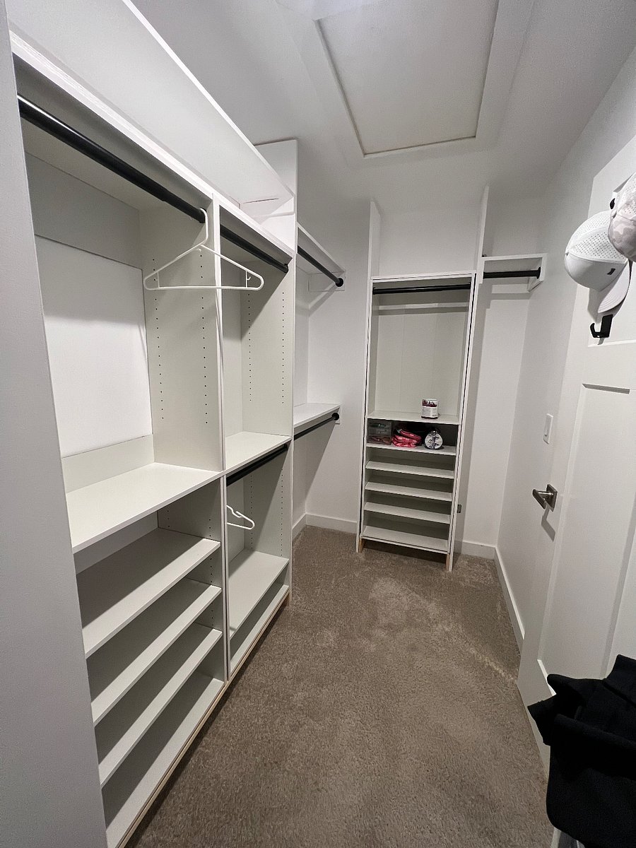 Master closet with boutique style shelving