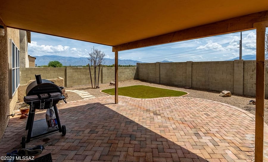 Back of home *not pictured: patio furniture (table and chairs) and natural gas grill, charcoal grill not included*