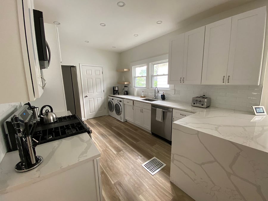 Brand new kitchen with a very modern Design, with waterfall counter top. 