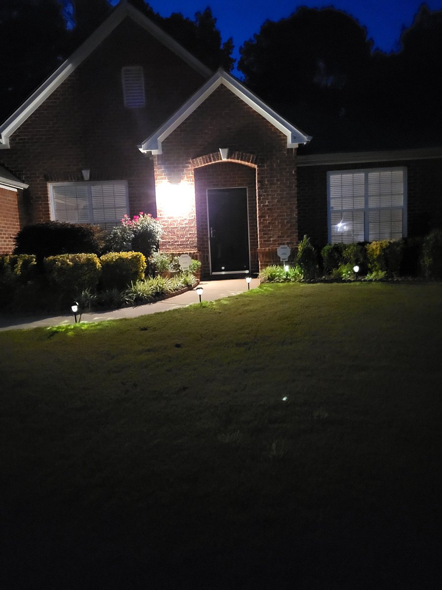 A night time view of property