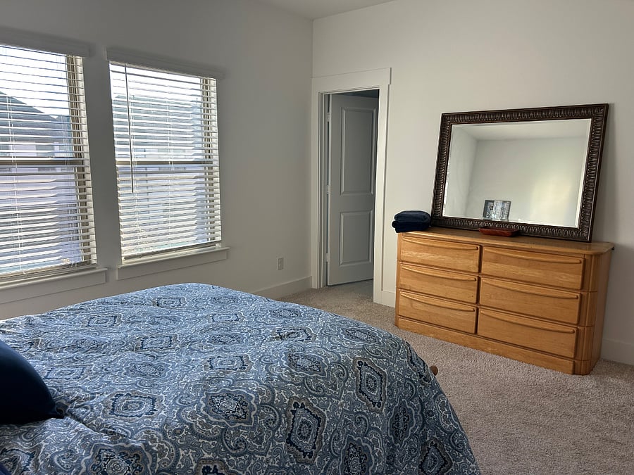 Dresser in bedroom. Walk-in closet