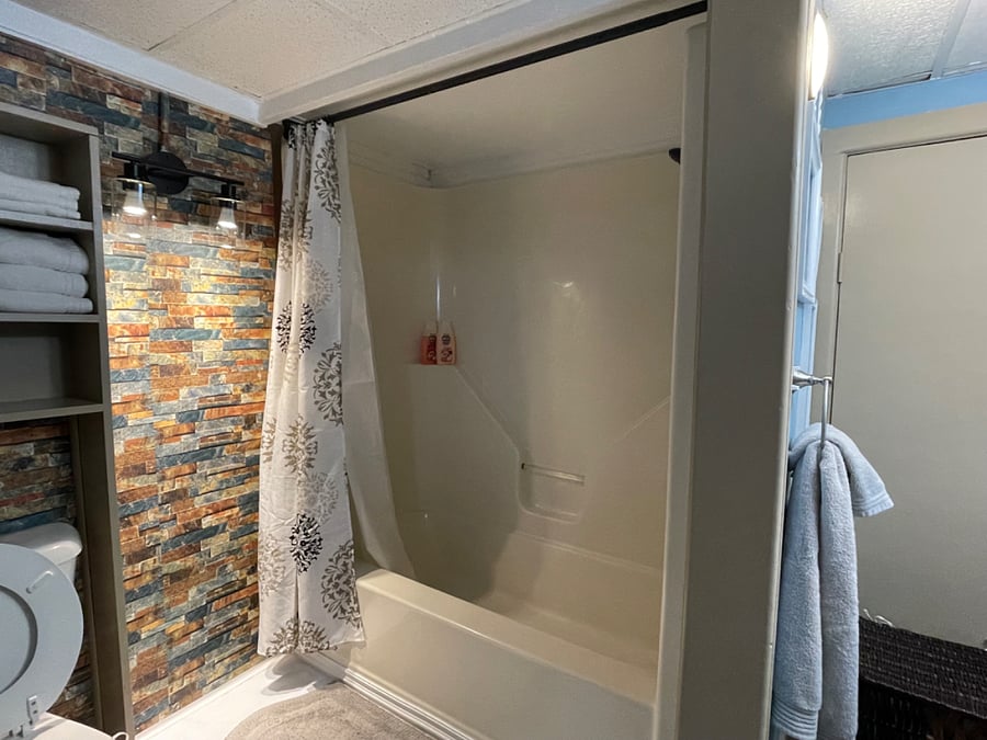 Renovated bathroom 2024 with new vinyl flooring.