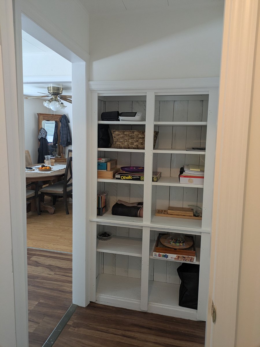 the other end of the hall, doorway to the kitchen/dining area