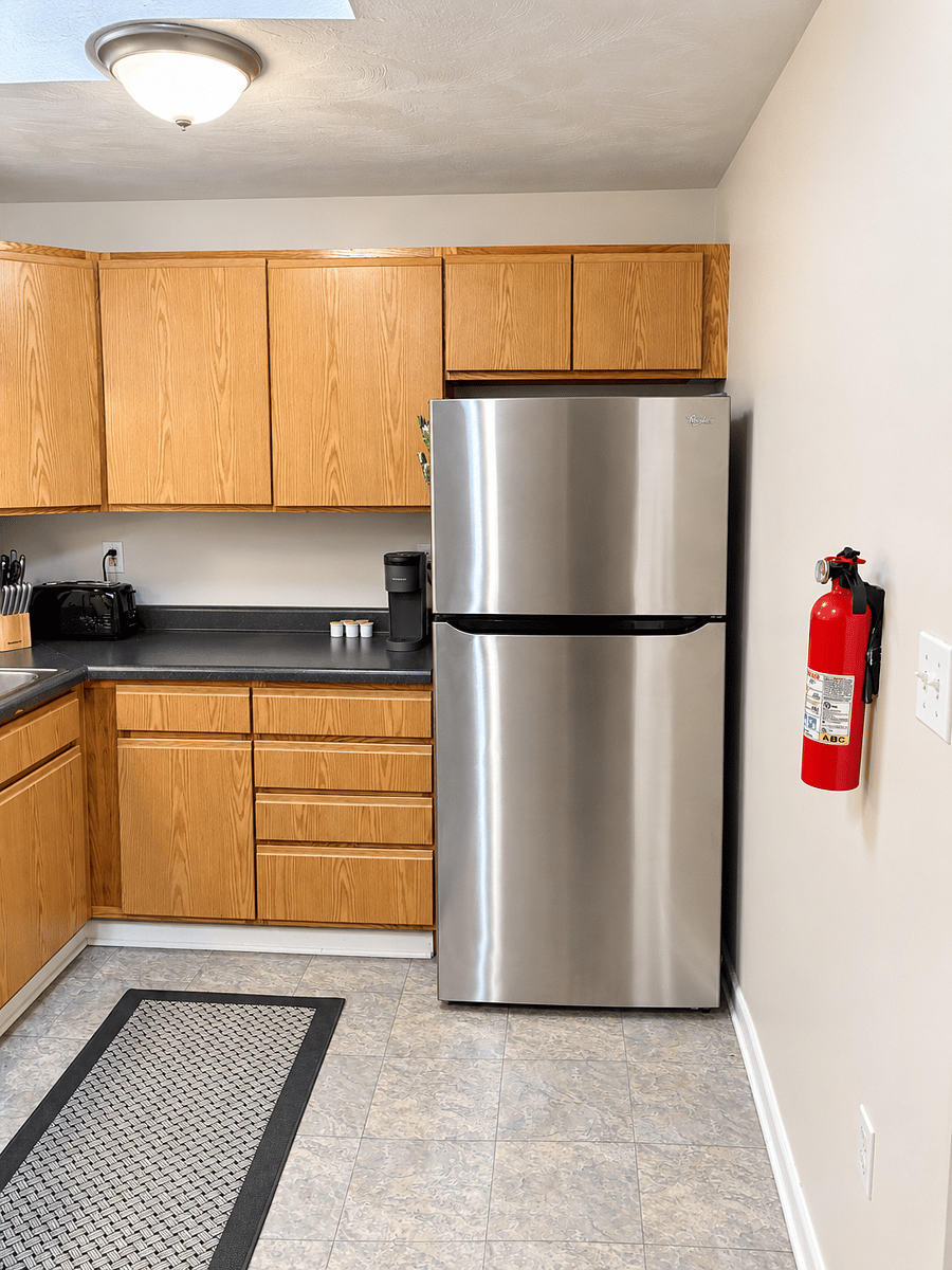 Full-size fridge, with toaster and Keurig.
