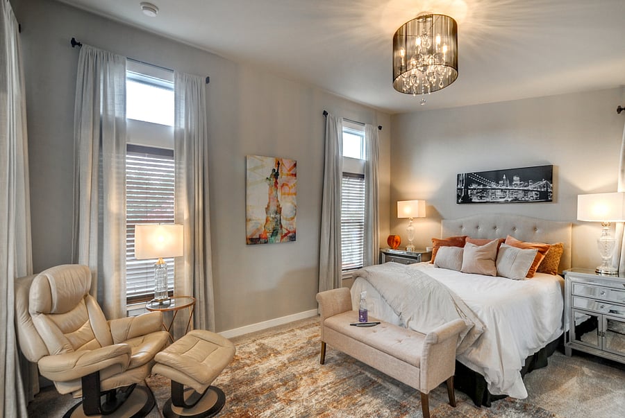 Upstairs queen bedroom with tall ceilings.