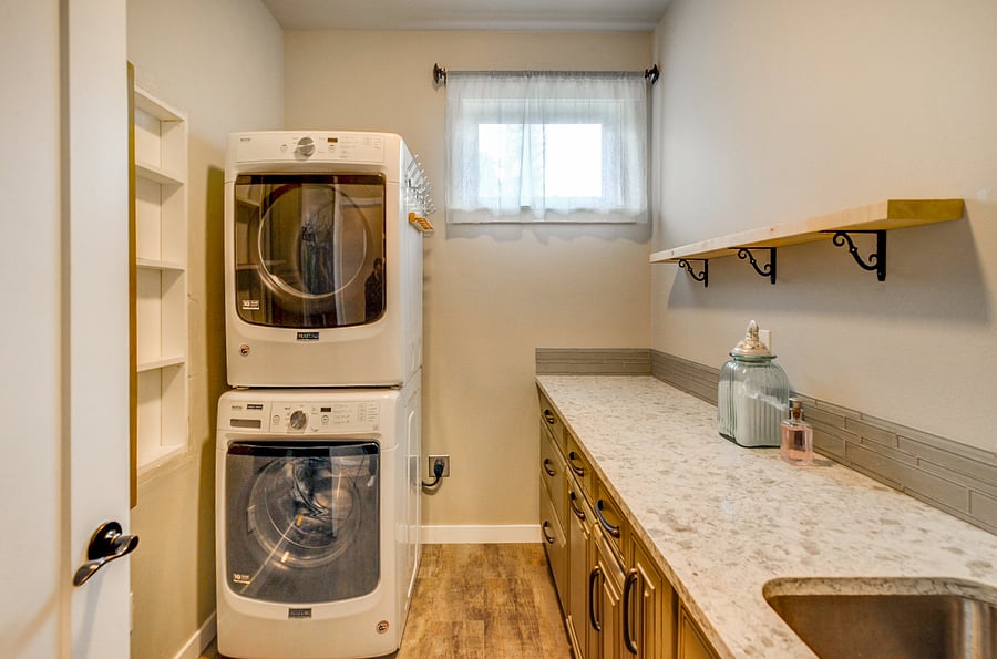 Full size washer and dryer. Large laundry sink. Plenty of storage.