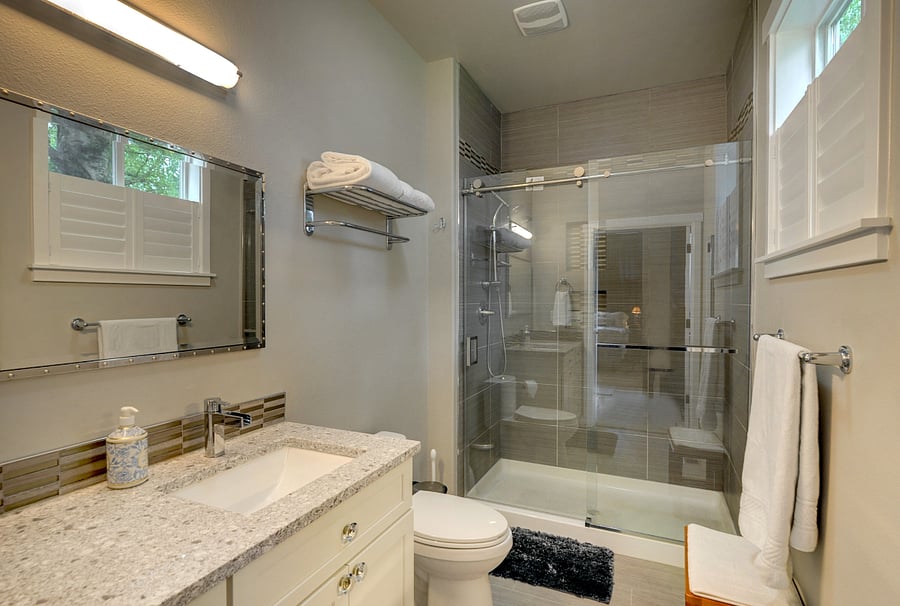 Main floor ensuite bathroom. A walk-in shower, comfort height toilet and tall sink is great for senior guests.