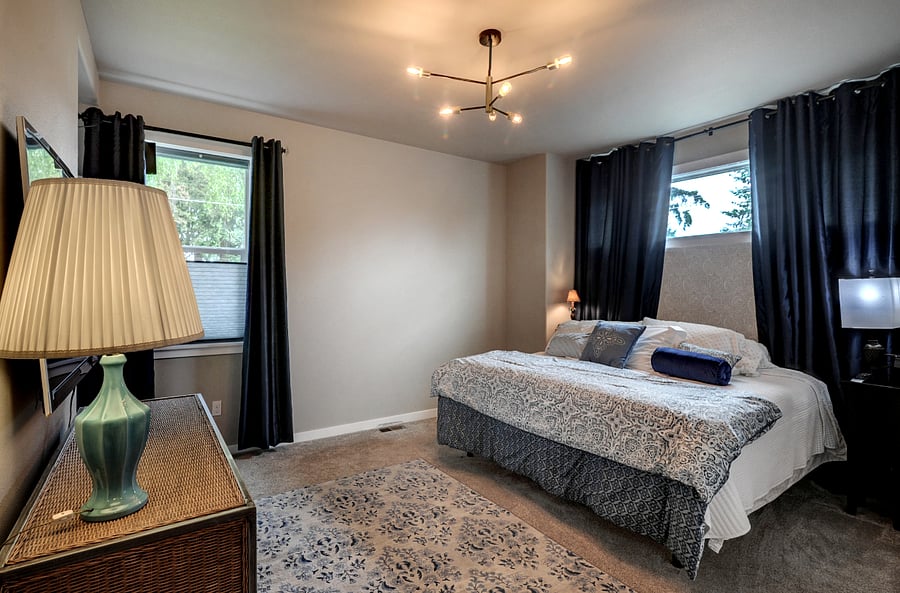 Main floor King size adjustable bed. Black out curtains.