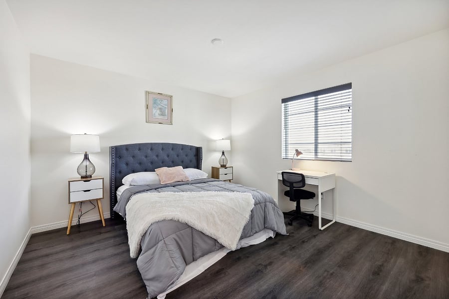 Work and unwind! This bedroom features a cozy workspace, perfect for productivity and relaxation