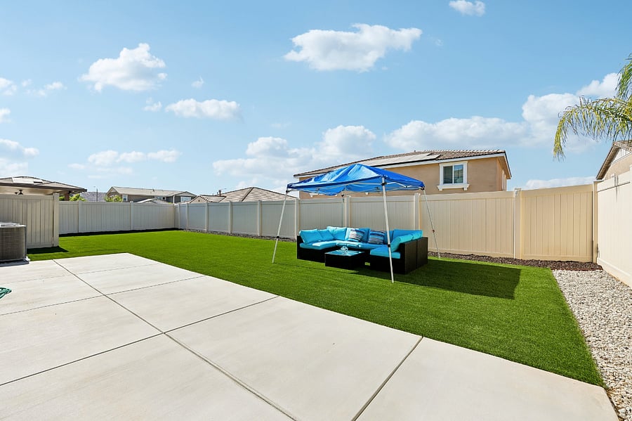 Enjoy a private backyard complete with a BBQ and comfortable outdoor furniture.