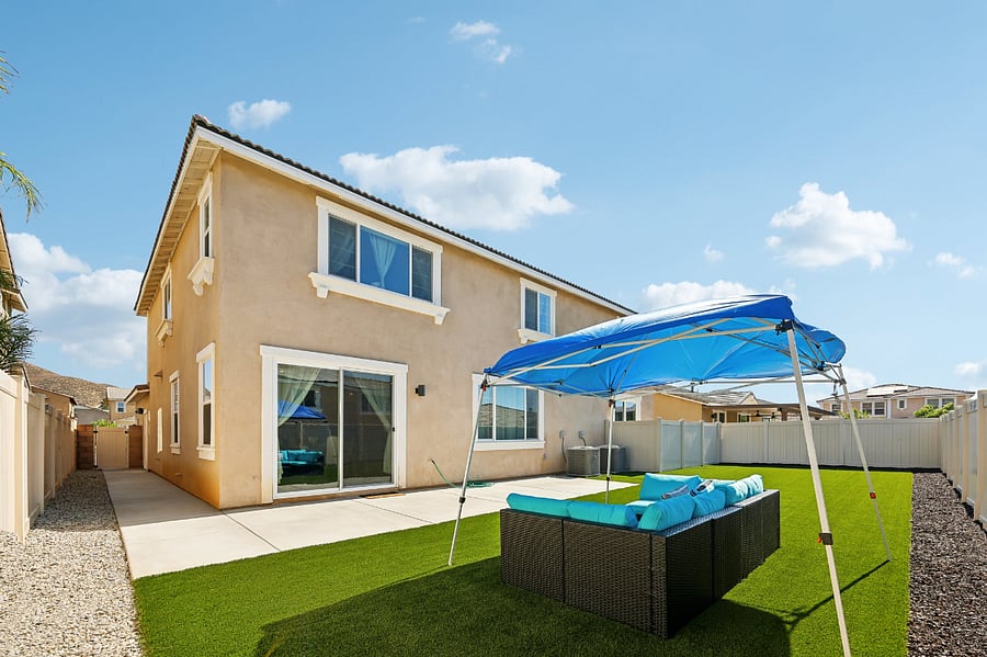 Enjoy the outdoors in our backyard, complete with comfortable outdoor furniture.