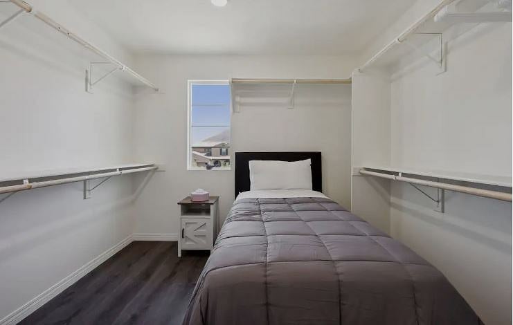 Drift off in this charming bedroom, complete with fresh linen.