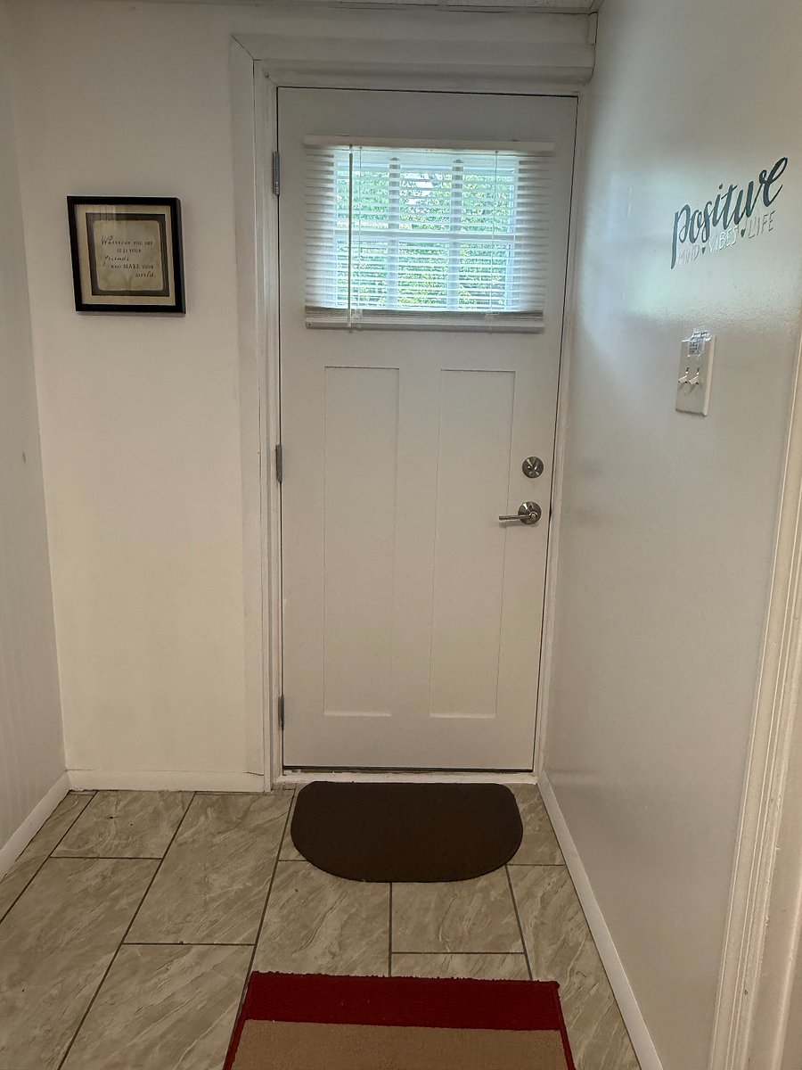 Back door with deadbolt lock.