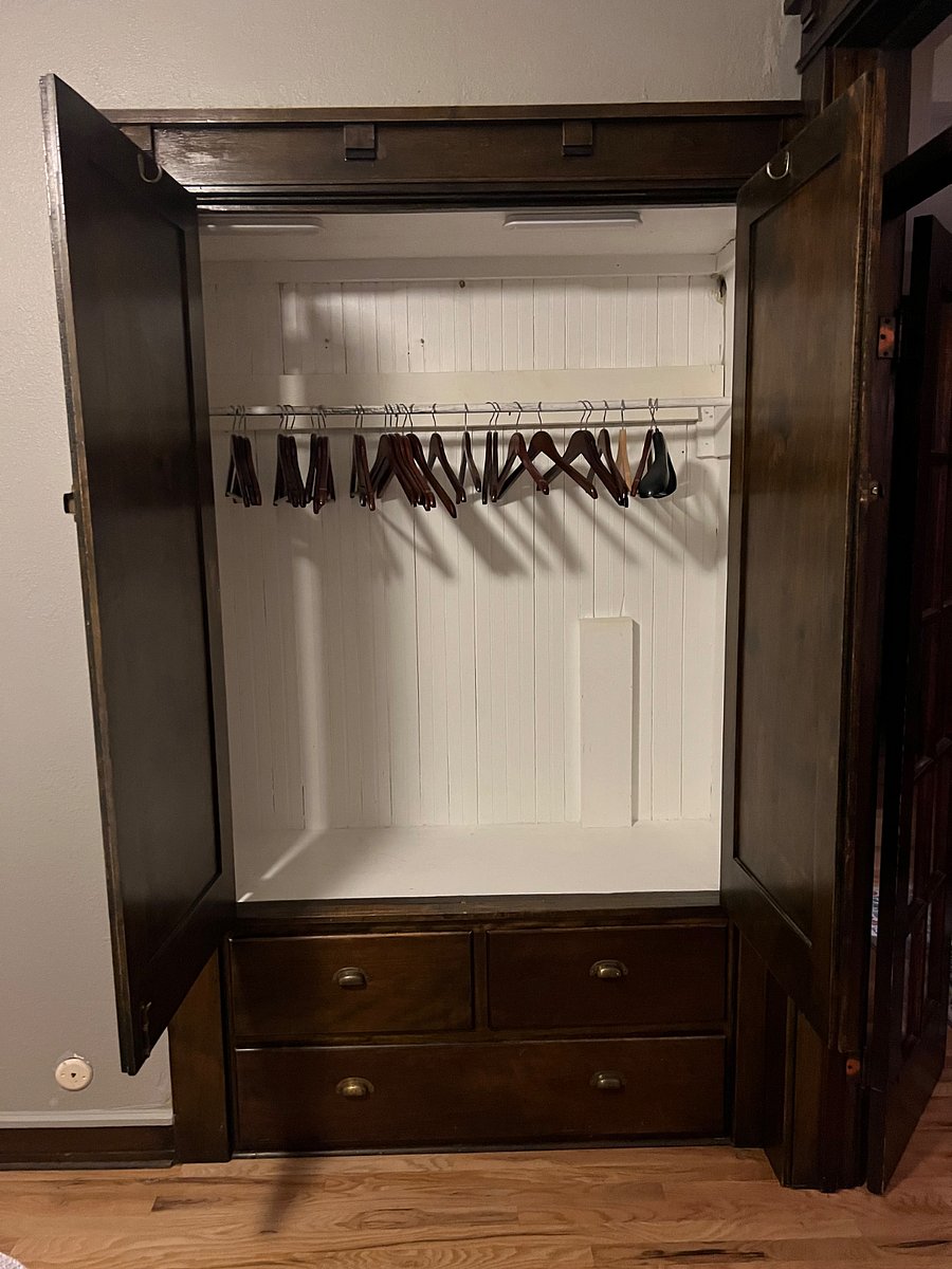 Full built in closet in bedroom - one of three in the unit - with hanging and drawer space.