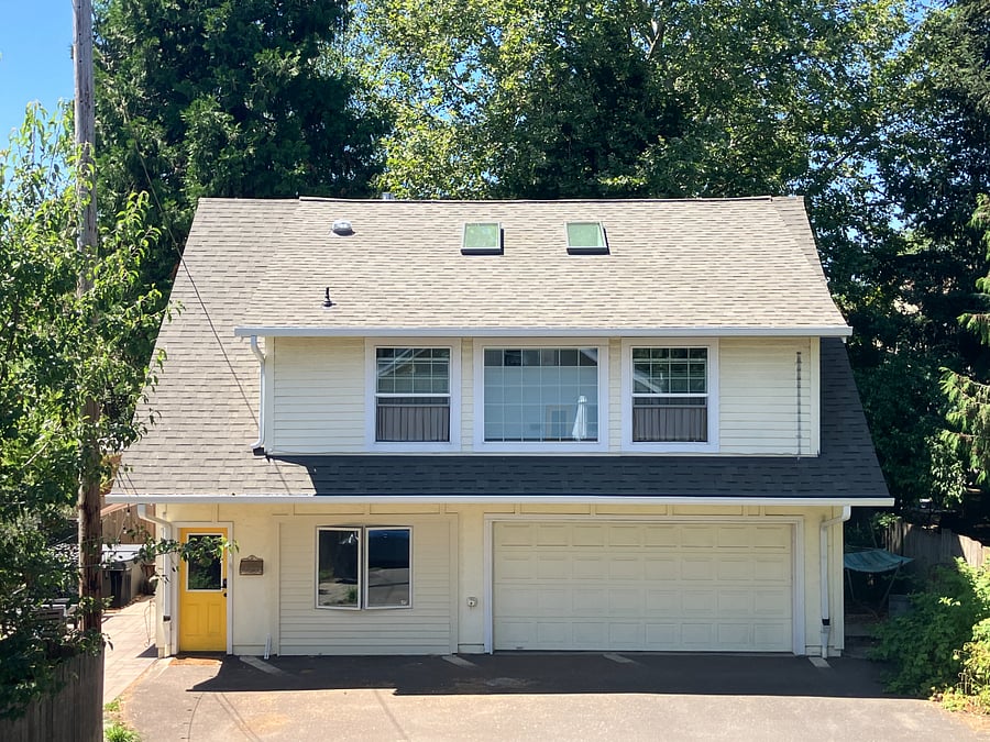 The loft apartment is the second floor of this building. It is rented to long term tenants who have pets.