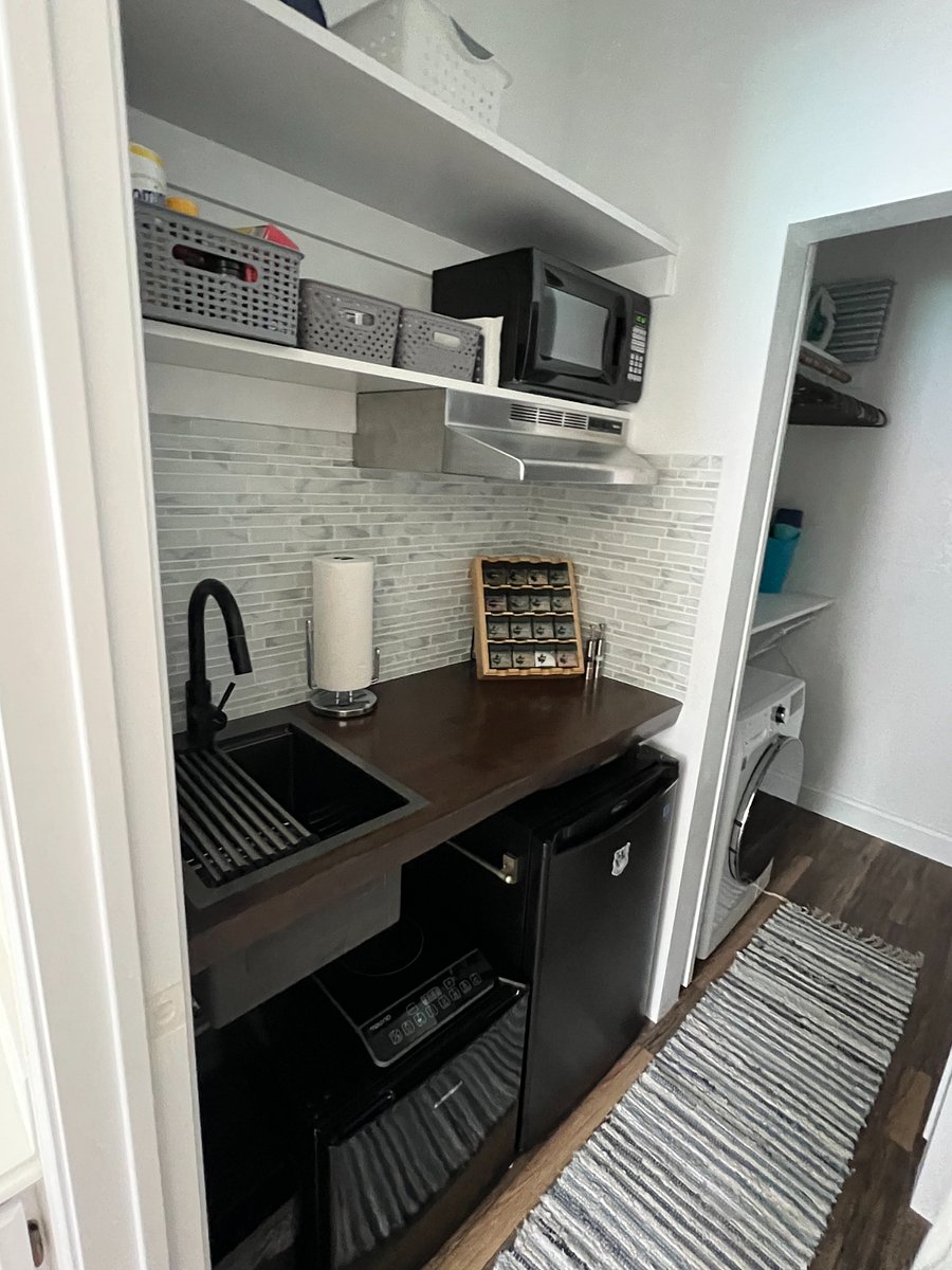Beautiful wood counters, glass backsplash. Deep sink with wood cutting board for extra counter space.