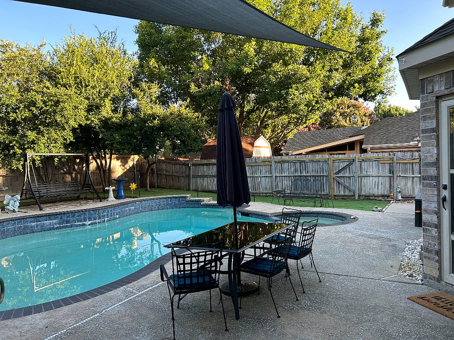 Hot tub and pool. Table wih umbrella