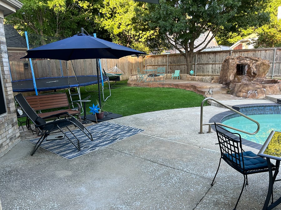 Several swings, fire-pit, fountain, trampoline