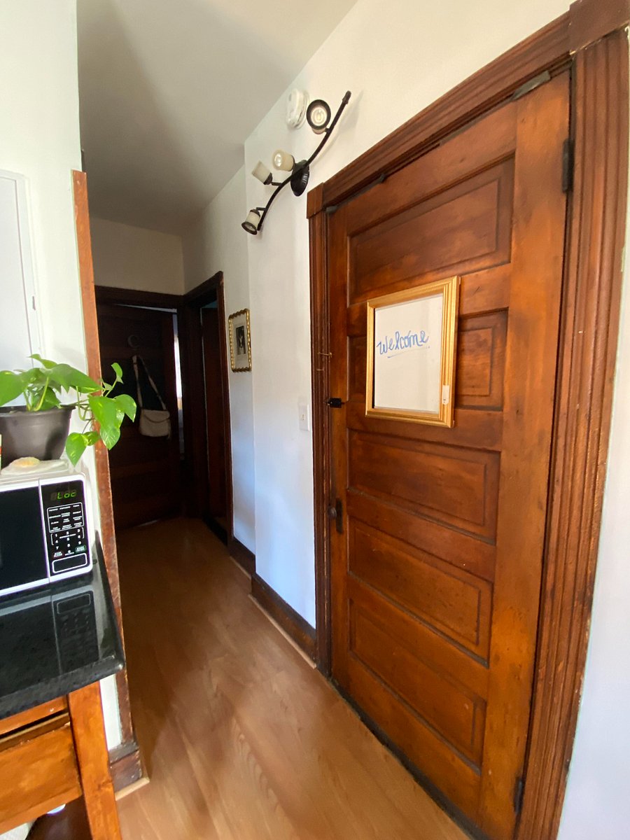 Door to additional exit, downstairs separate unit, and basement. Bedrooms and bathroom in this hallway are occupied by me!