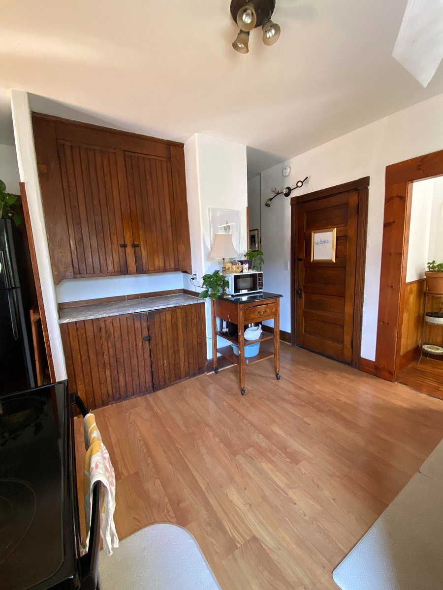 Food storage and lower area holds trash, compost and bottle redemption. Recycling lives behind the door leading to the basement as well as additional cleaning supplies.