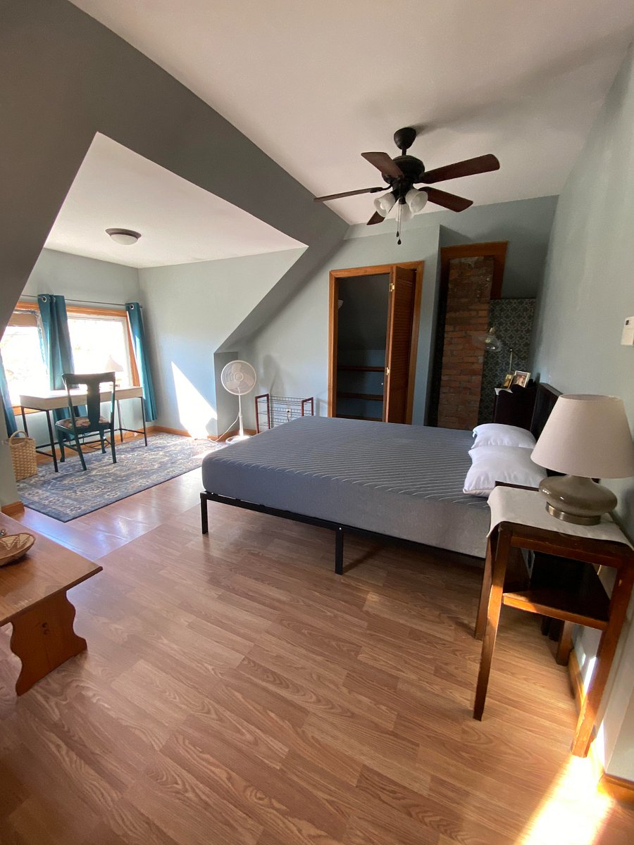 New queen Siena mattress gets great morning light from the windows. Small end table and book shelf on each side of the bed for convenient storage.