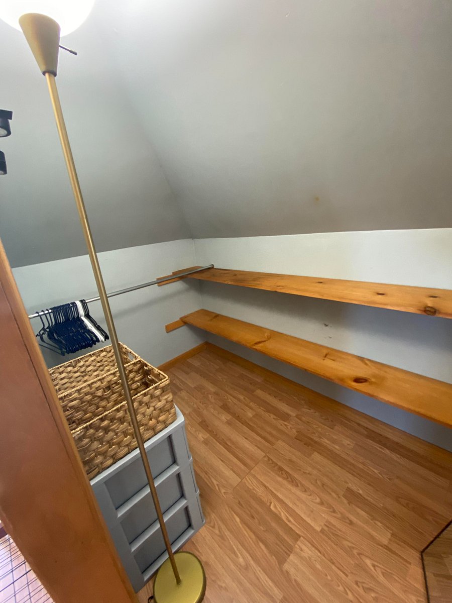 Large walk in closet next to shoe rack in primary bedroom. Small plastic drawer set and storage baskets in additional to shelving for clothing storage. Full length mirror is easily moveable throughout the room should you wish to move it.