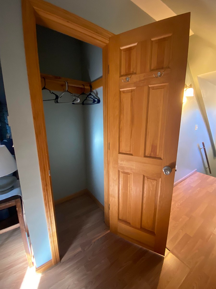 Tall closet across from dining area for long jackets, pants, and/or dresses.