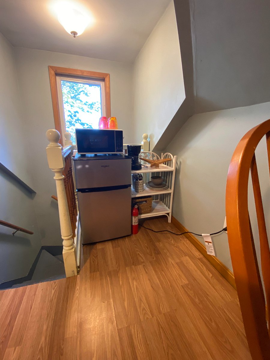New whirlpool 3.1cf mini fridge, small microwave, coffee maker, table settings, and shelfs for food, should you want to keep snacks upstairs.