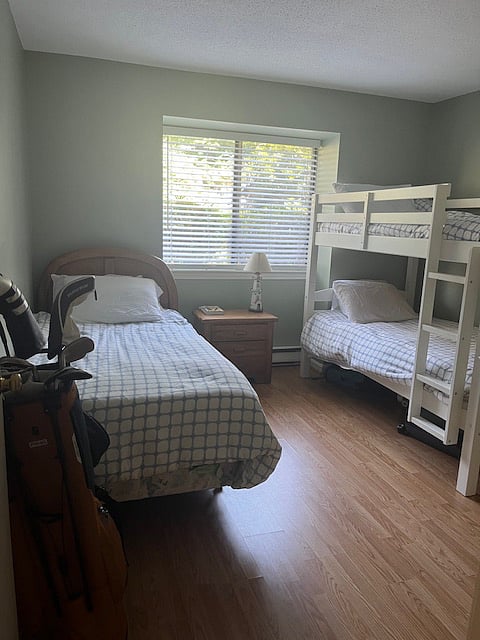 One twin bed and bunk beds.