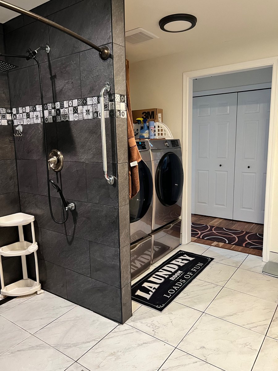 Front load washer and dryer. The washer and dryer is shared. The rest of the bathroom is for the private use of the tenant. Right across the hallway is the large closet that goes with the room. Tenant room is to the left, kitchen and rest of the house is to the right out of this door. 