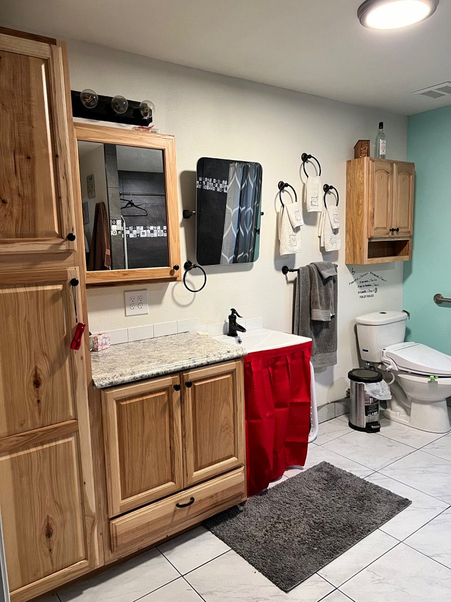Sink, counter space, and lots of storage in the bathroom is all for the tenant. 