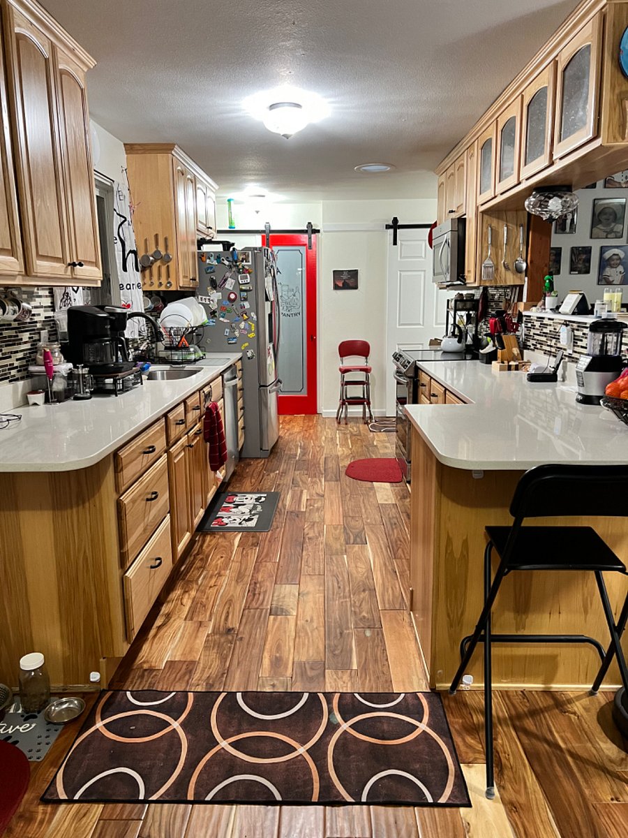 Galley style kitchen - pantry is straight ahead. Tenant space is to the right. 