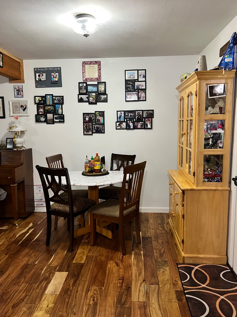 Dining room table seats 4 with an assortment of condiments available for tenant use. 