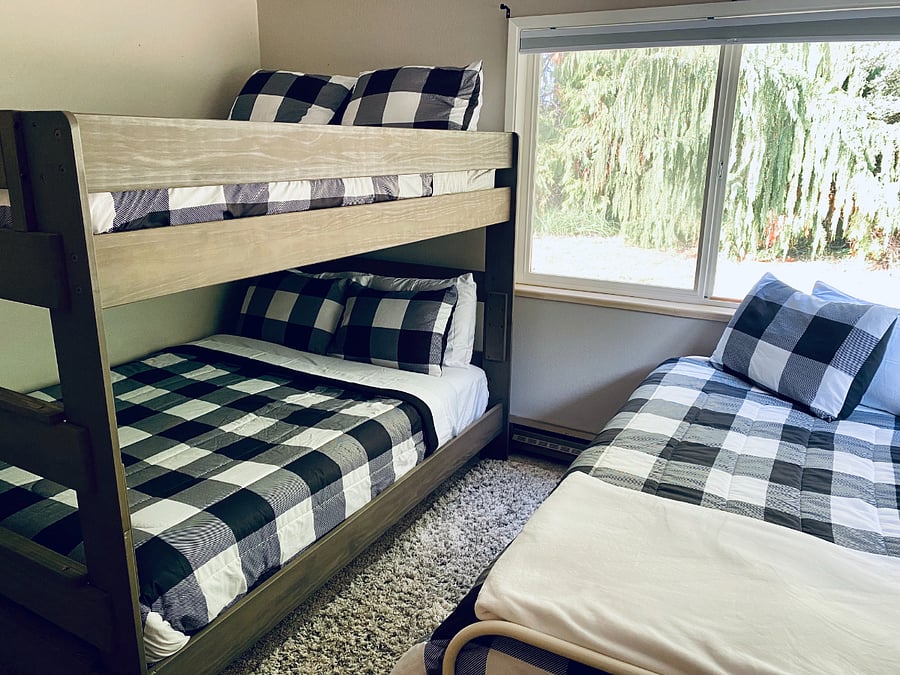 The bunk room offers a queen over queen bunk + a twin bed.
Each room is well appointed with plenty of extra bedding.