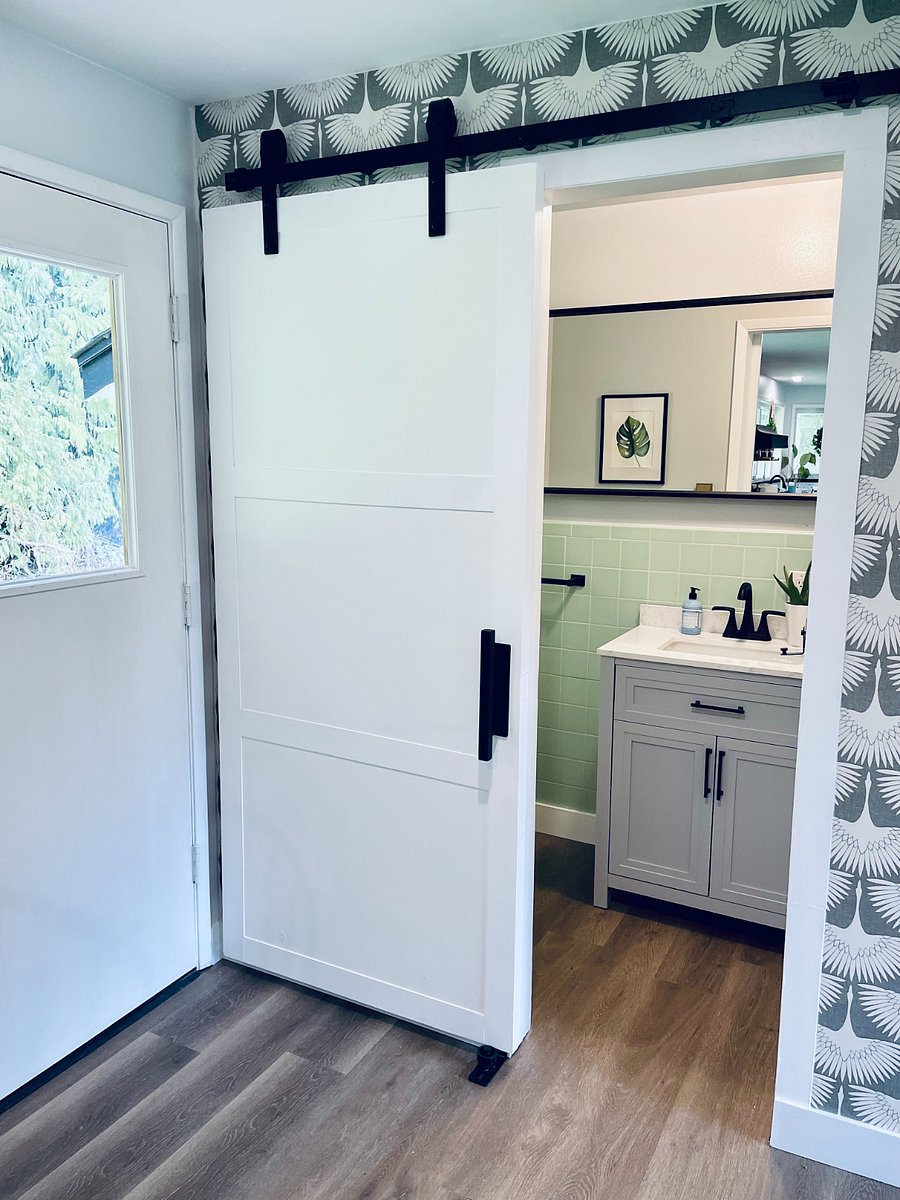 Bathroom with a shower off of the kitchen + den