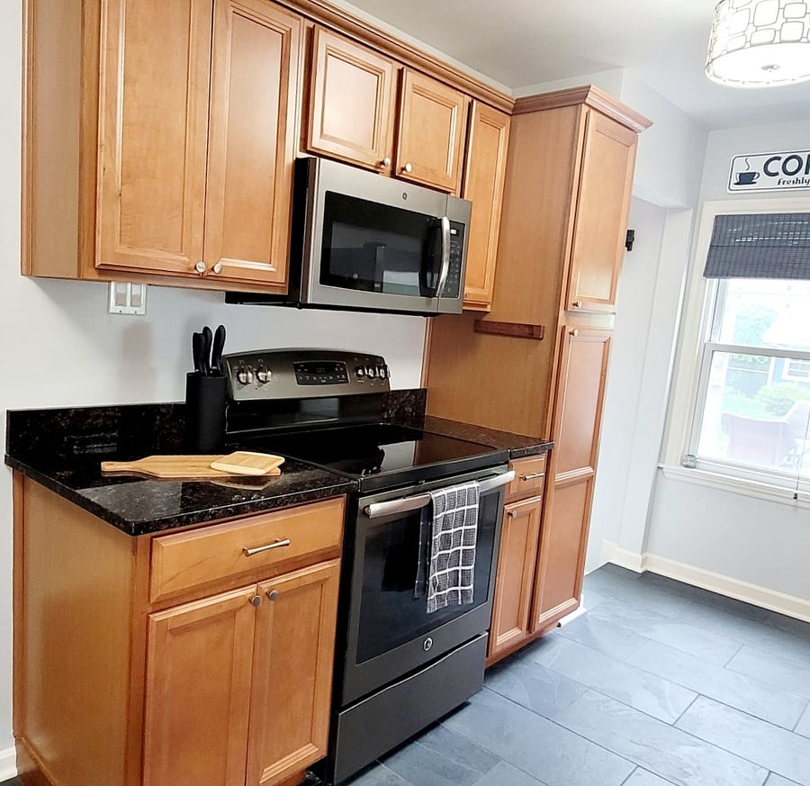 Granite countertops, maple cabinets, glass-top electric stove