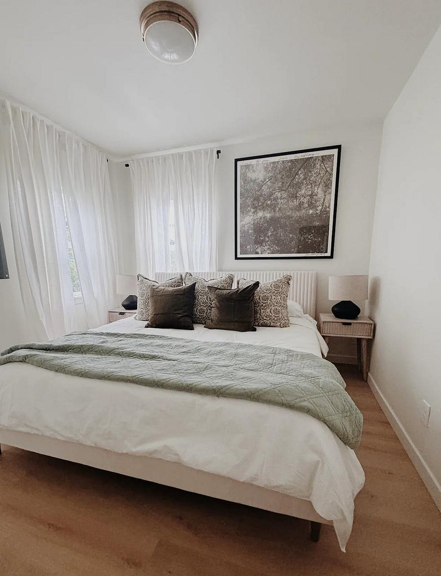 Wake up refreshed in the master bedroom featuring a plush king-size bed.