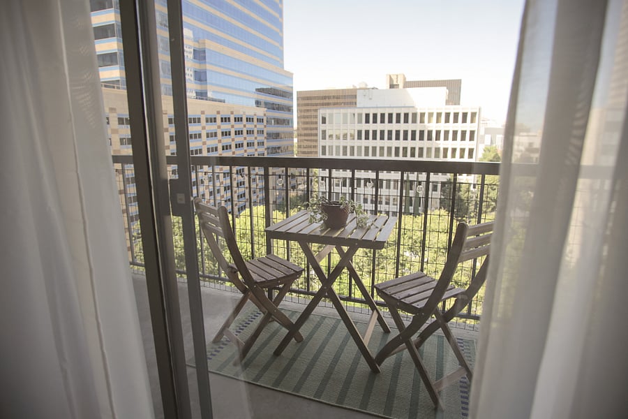 Bedroom opens onto balcony.