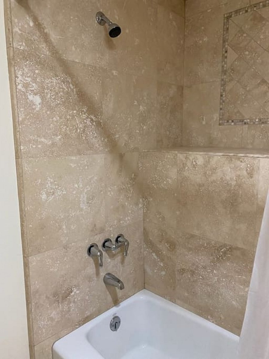Beautifully tiled bathtub and shower combo