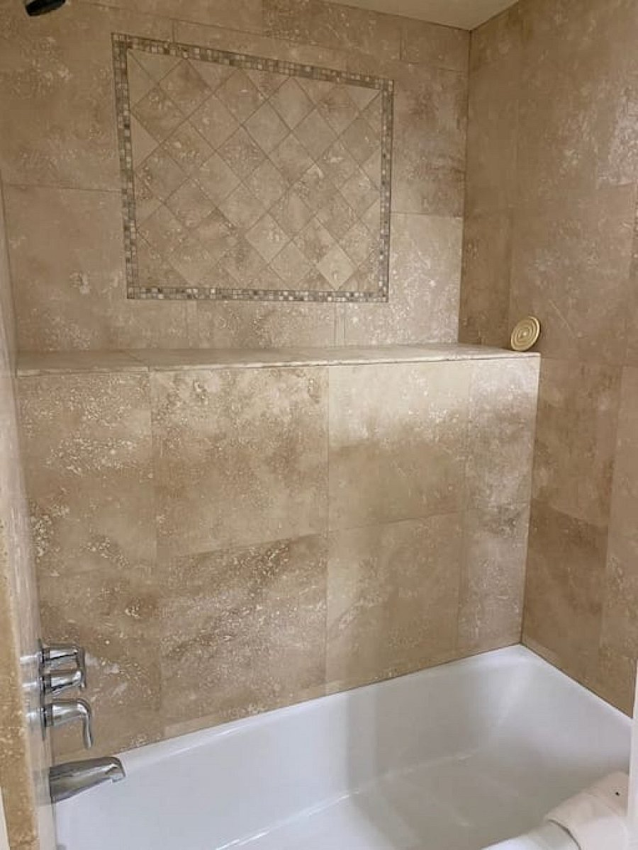 Beautifully tiled bathtub and shower combo