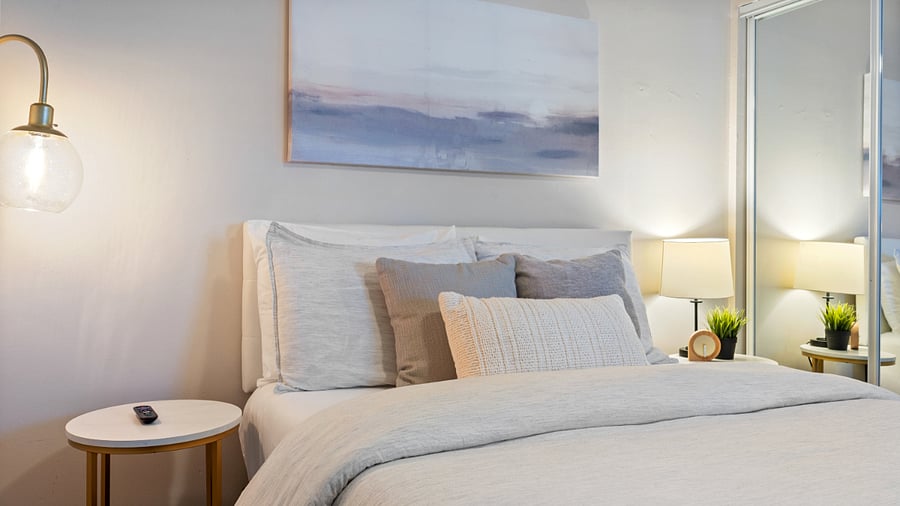 Queen bedroom with dresser and TV 