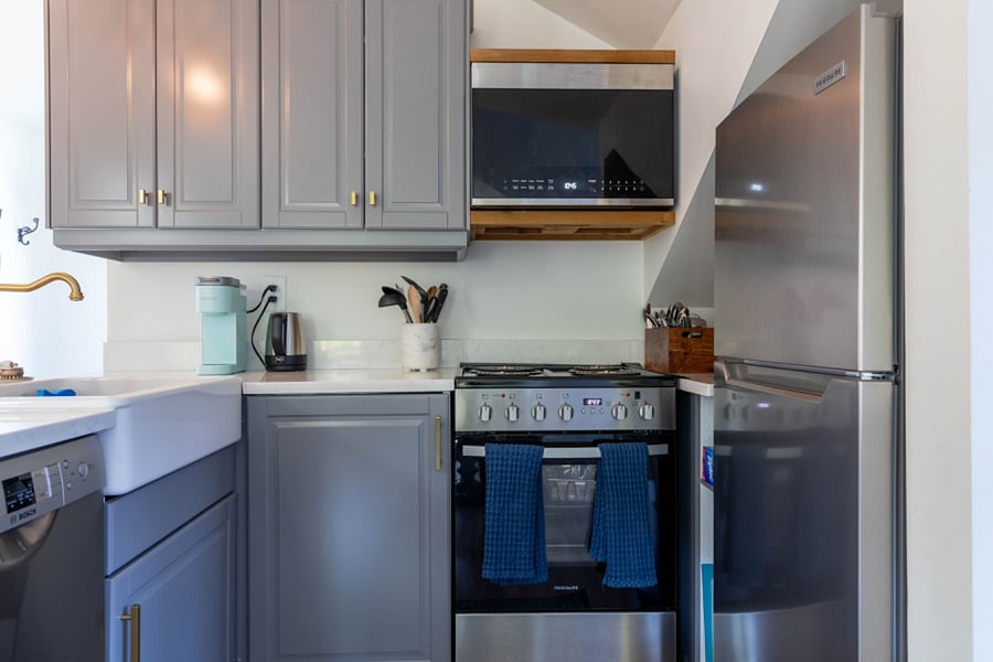 Full kitchen - dishwasher, fridge, stove and microwave along with every possible thing you could need to cook a full meal