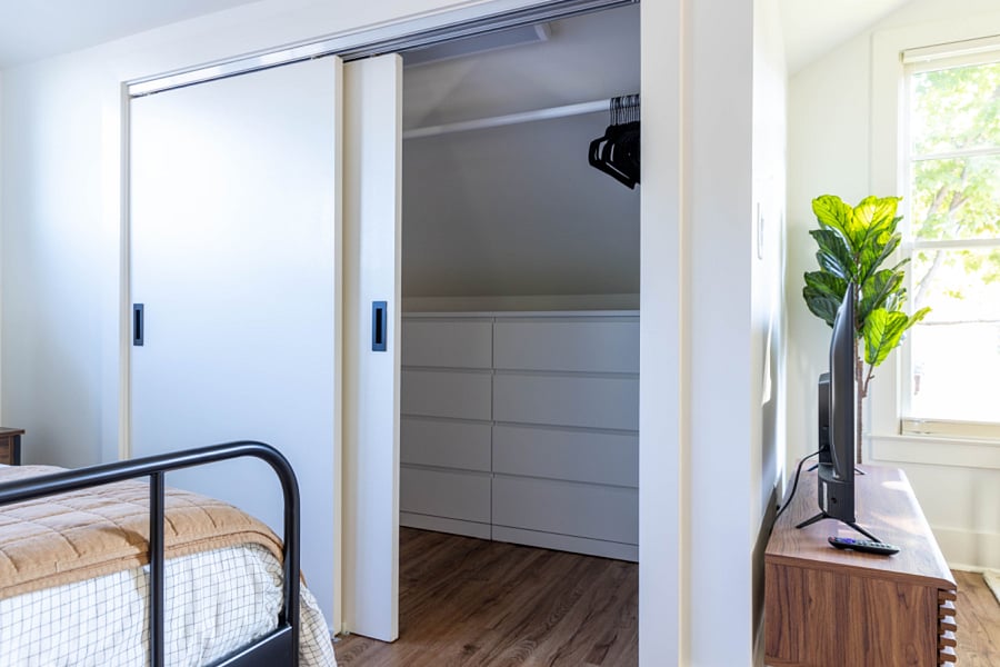Walk-in closet with 2 dressers